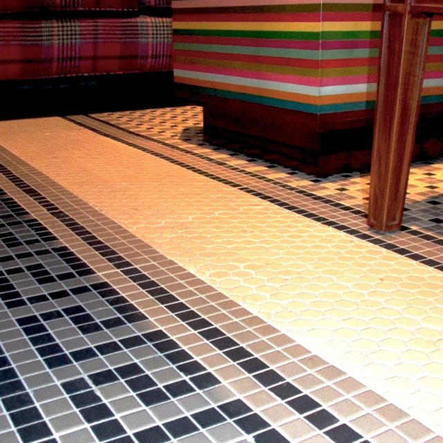 patterned porcelain tile surrounds the bar