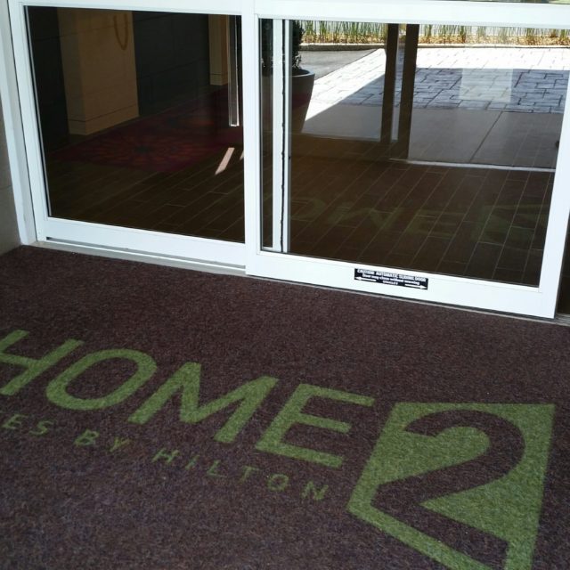 Front mat with Home 2 Suites logo