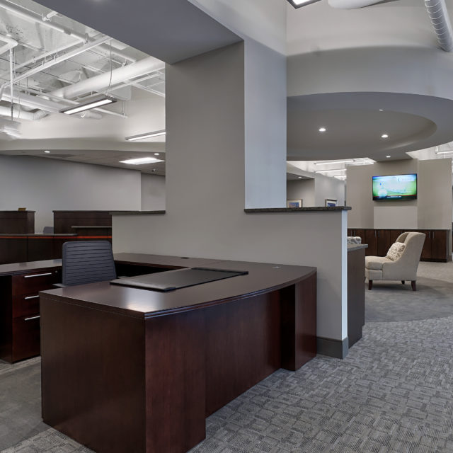 Work space at Southern First Bank with heather grey carpet